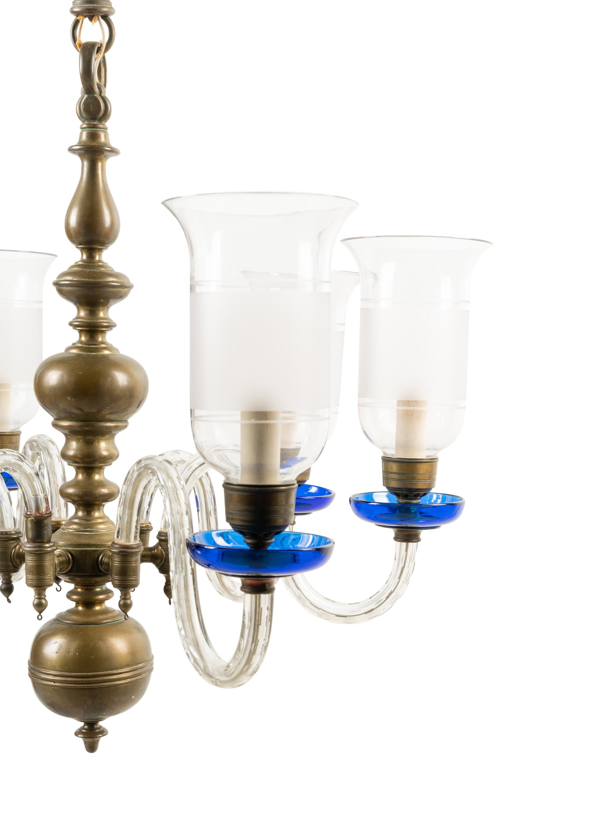 A Baroque Style Brass and Glass Six-Light Chandelier