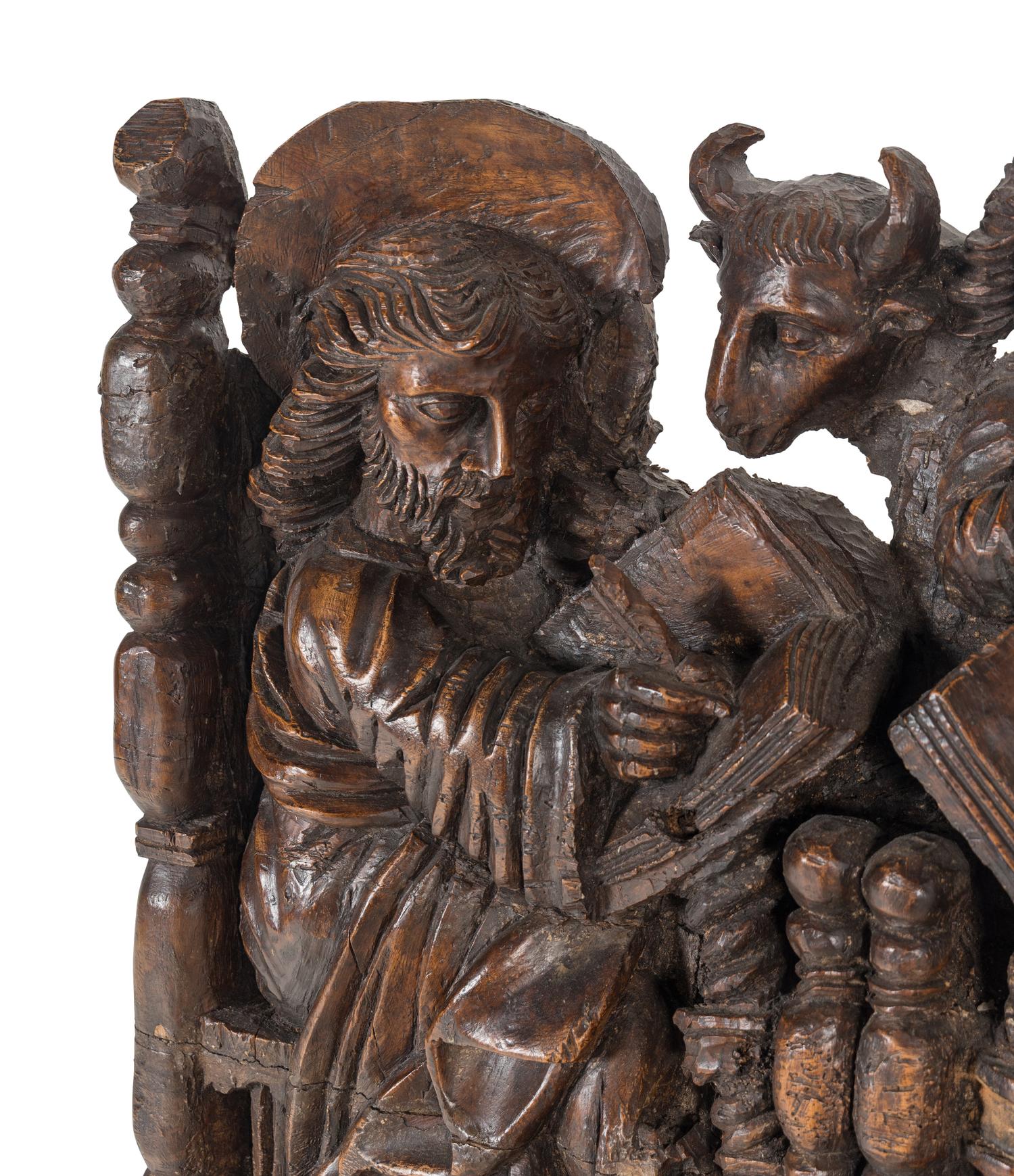 A Spanish Colonial Walnut Frieze Depicting the Four Evangelists