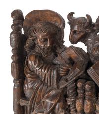 A Spanish Colonial Walnut Frieze Depicting the Four Evangelists