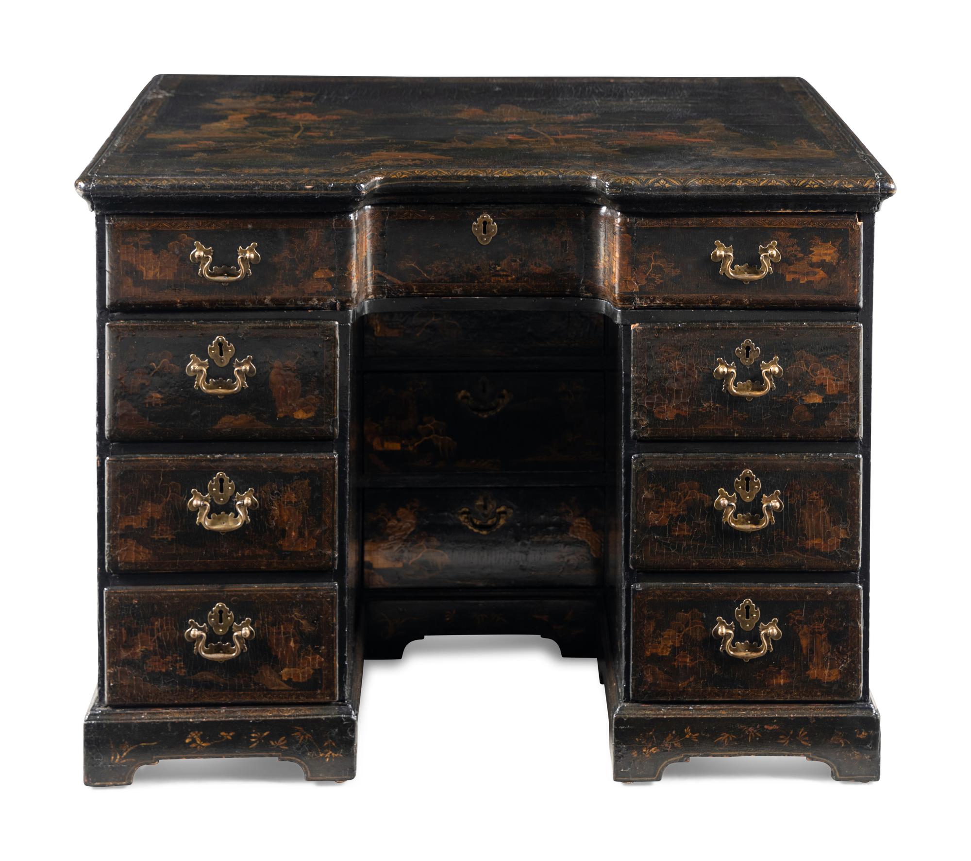 A Chinese Export Black and Gilt Lacquered Kneehole Desk