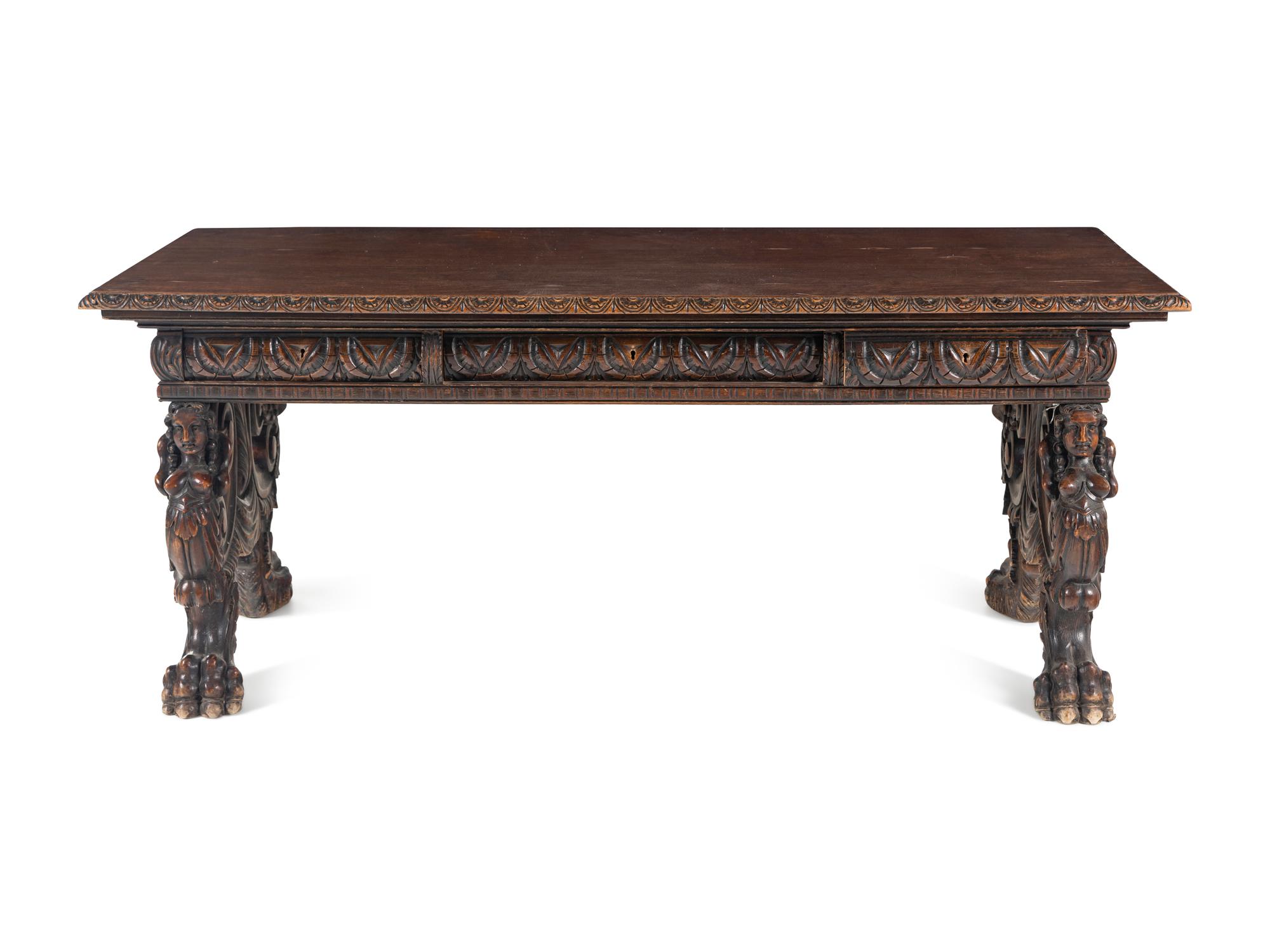 A Renaissance Revival Carved Walnut Trestle Table
