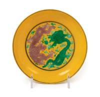 A Yellow Ground Green, Aubergine and Black Decorated Saucer Dish
