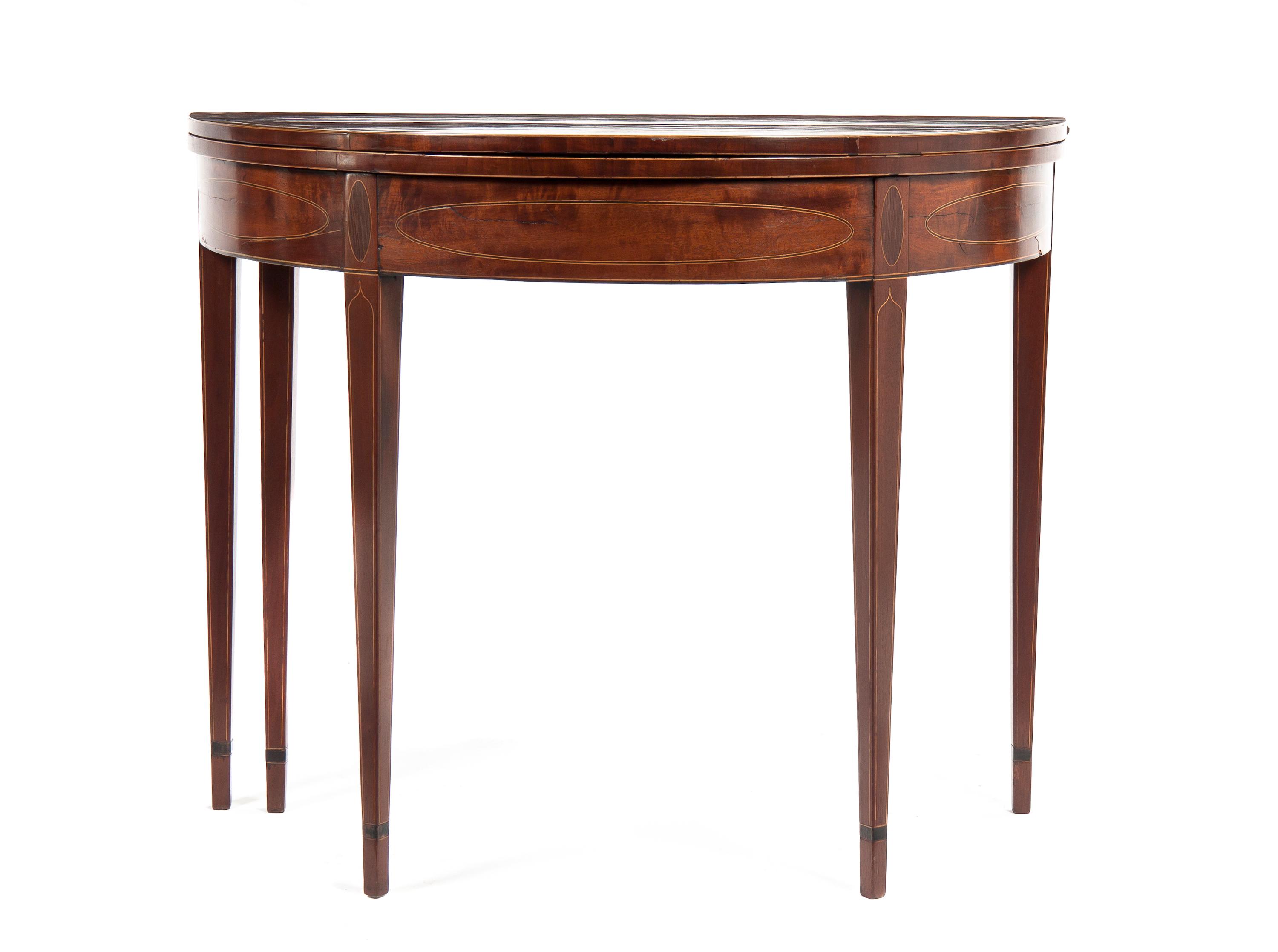 A Federal Mahogany Demilune Flip-Top Games Table, Height 29 1/2 x width 35 x depth 17 1/2 inches (closed).