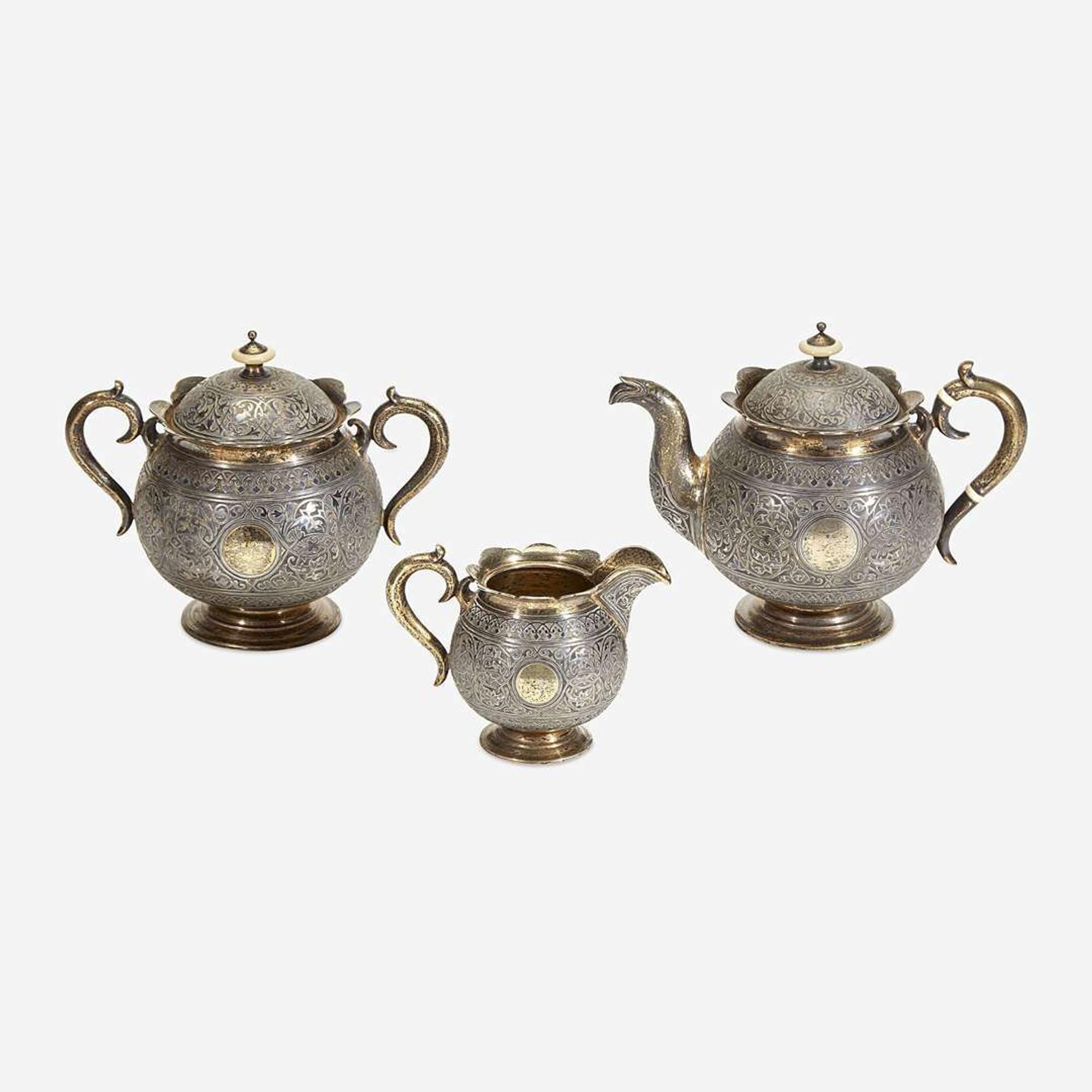 A Russian Parcel-Gilt Silver and Niello Three-Piece Tea Service Mikhail Fyodorovich Sokolov, assay master Anatoly Appollonovich Artsybashev, Moscow, 1893