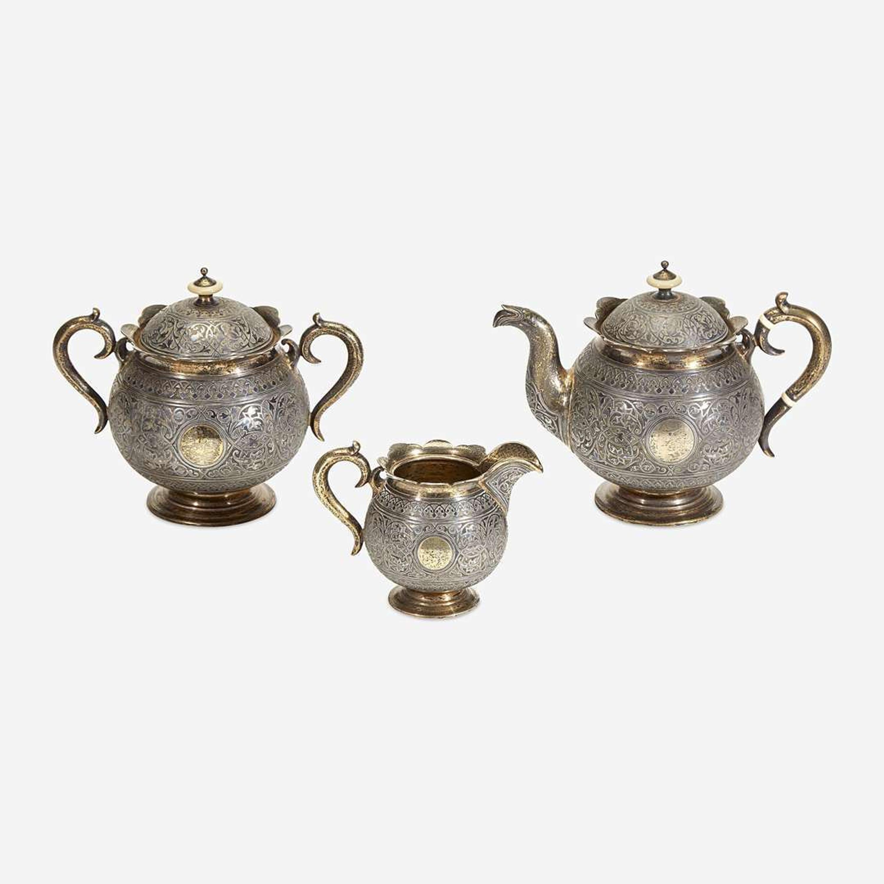 A Russian Parcel-Gilt Silver and Niello Three-Piece Tea Service Mikhail Fyodorovich Sokolov, assay master Anatoly Appollonovich Artsybashev, Moscow, 1893