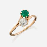 A diamond, emerald, and gold ring