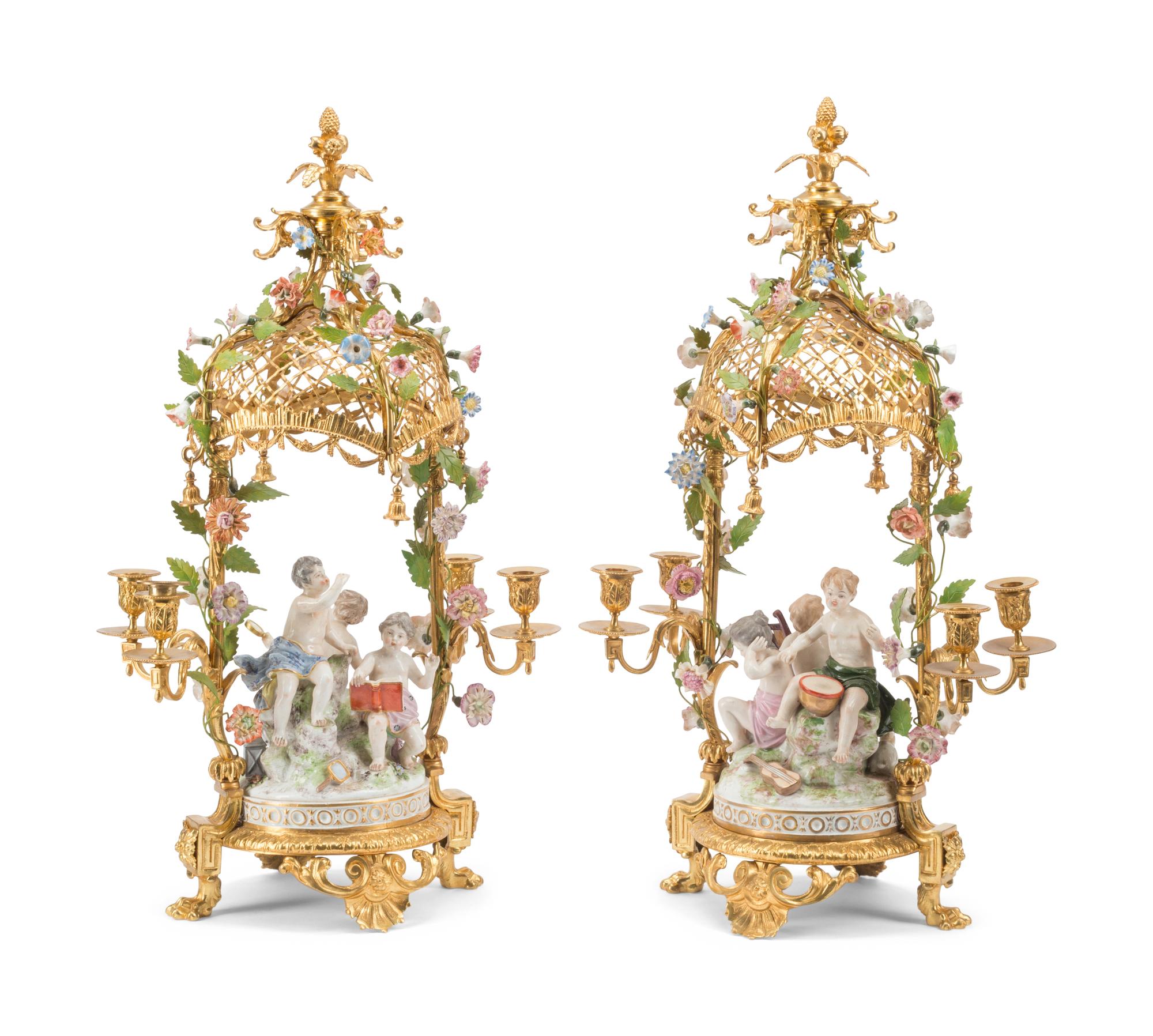 A Pair of French Gilt Bronze and Porcelain Figural Four-Light Candelabra