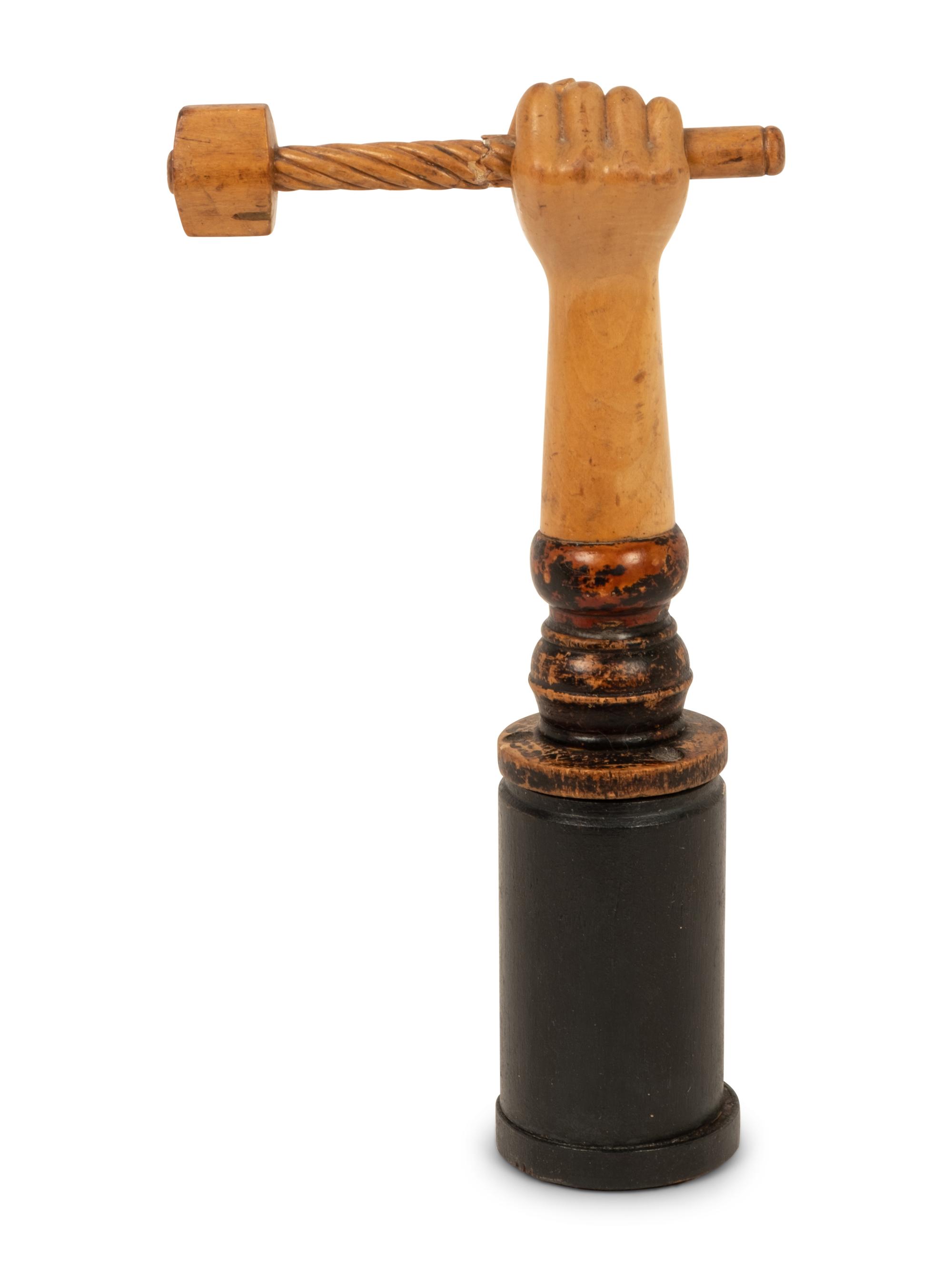 A Folk Art Carved and Polychrome Painted Hand Clutching a Hammer