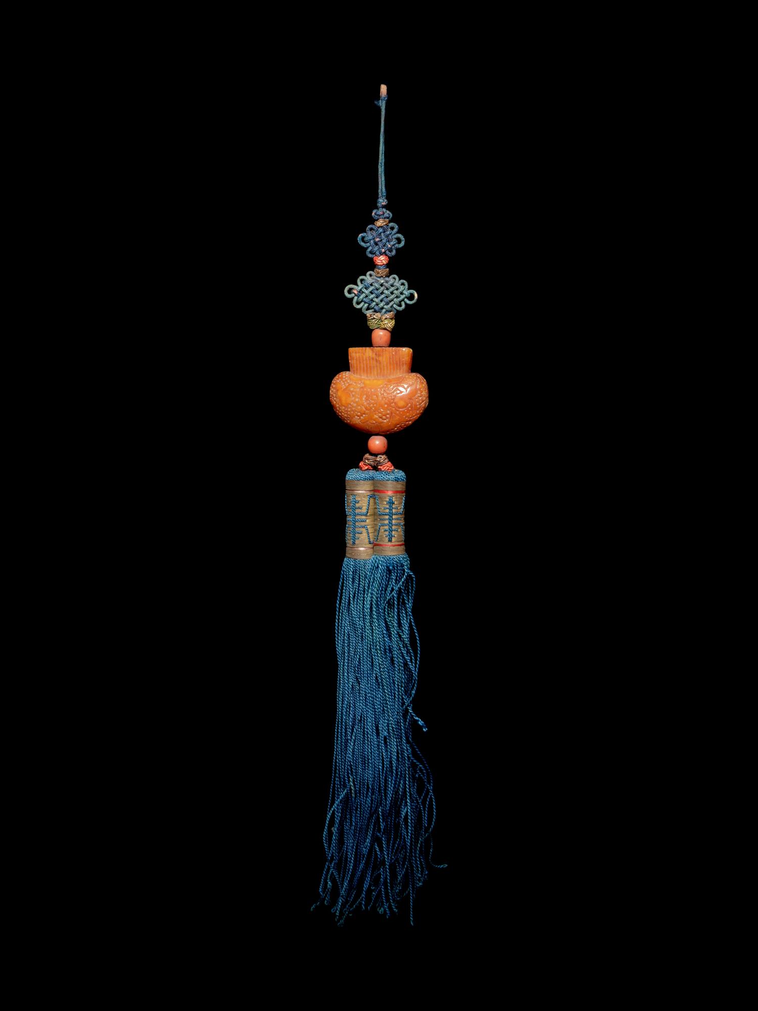 A Beewax Purse-Form Pendant