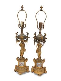 A Pair of French Porcelain Mounted Gilt Bronze Figural Lamps