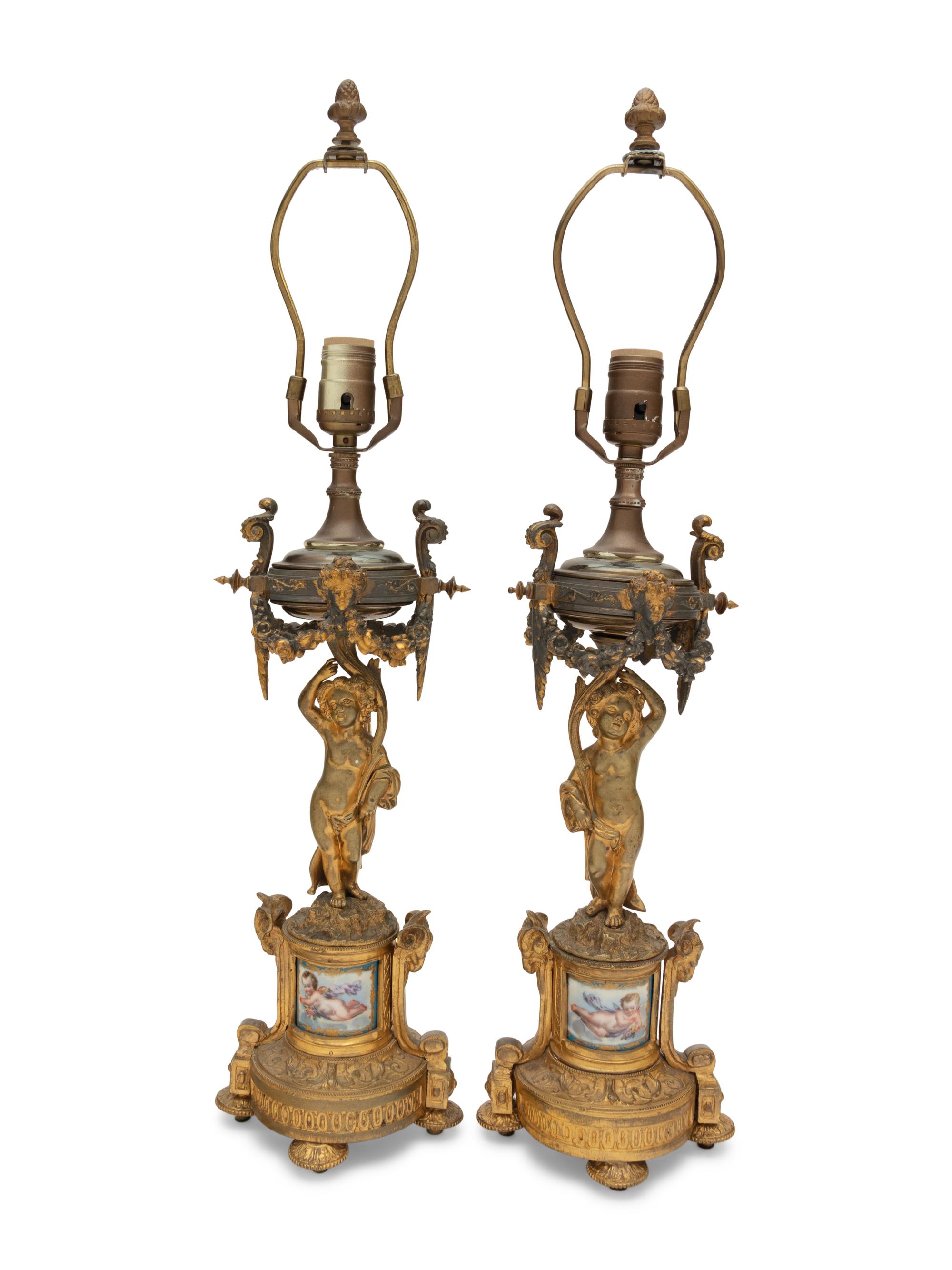 A Pair of French Porcelain Mounted Gilt Bronze Figural Lamps