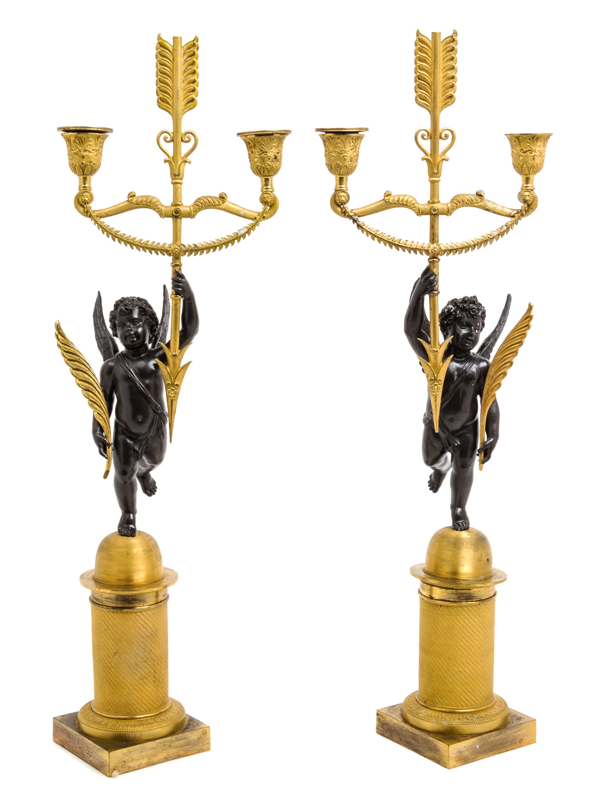 A Pair of Gilt and Patinated Bronze Two-Light Figural Candelabra Height 21 3/4 inches. — 19TH CENTURY