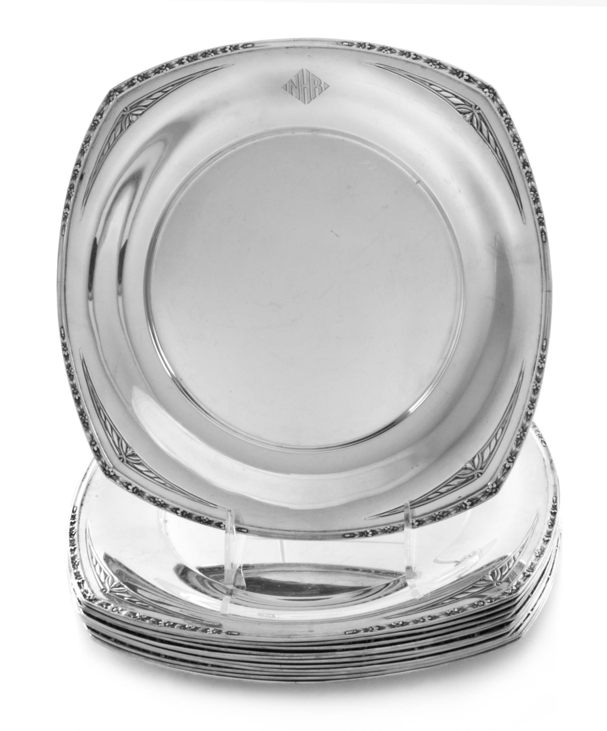 Twelve American Silver Dinner Plates, R. Wallace and Sons, Wallingford, CT, of square form with rounded sides, the rims worked to show