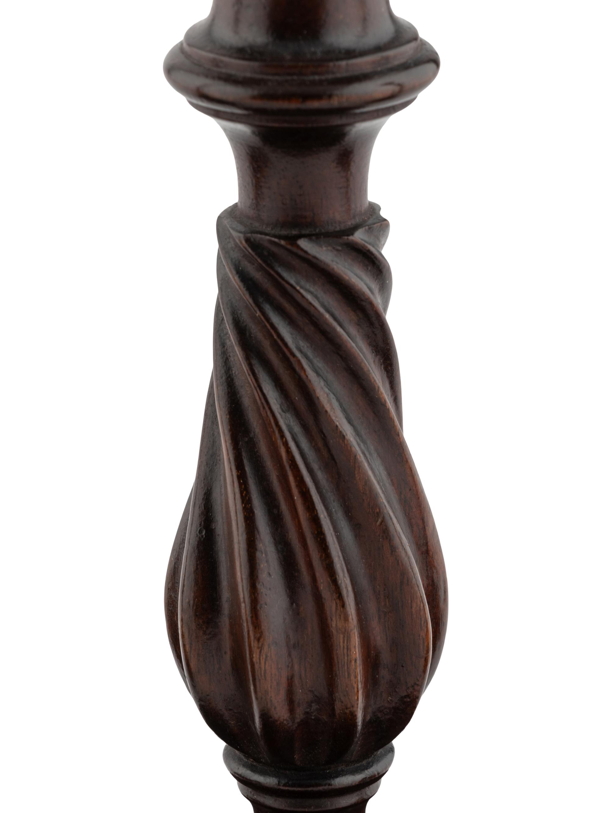 A Group of Four English Mahogany and Brass Mounted Candlesticks