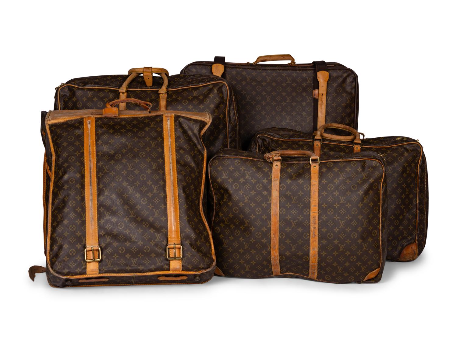 A Group of Five Louis Vuitton Travel Articles