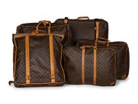 A Group of Five Louis Vuitton Travel Articles