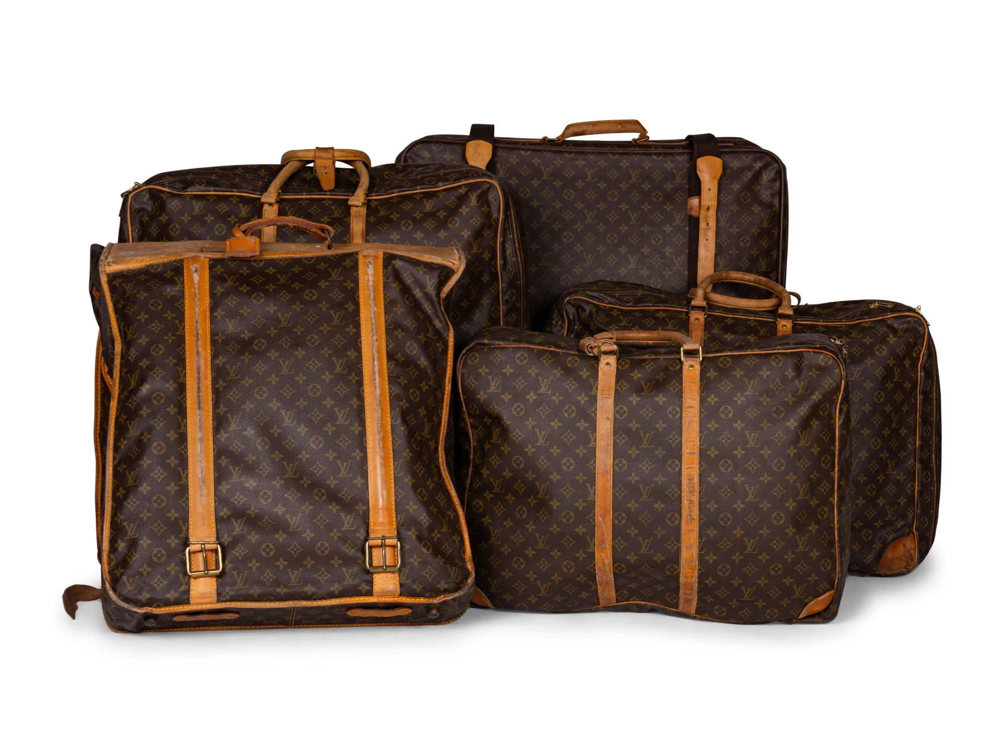 A Group of Five Louis Vuitton Travel Articles