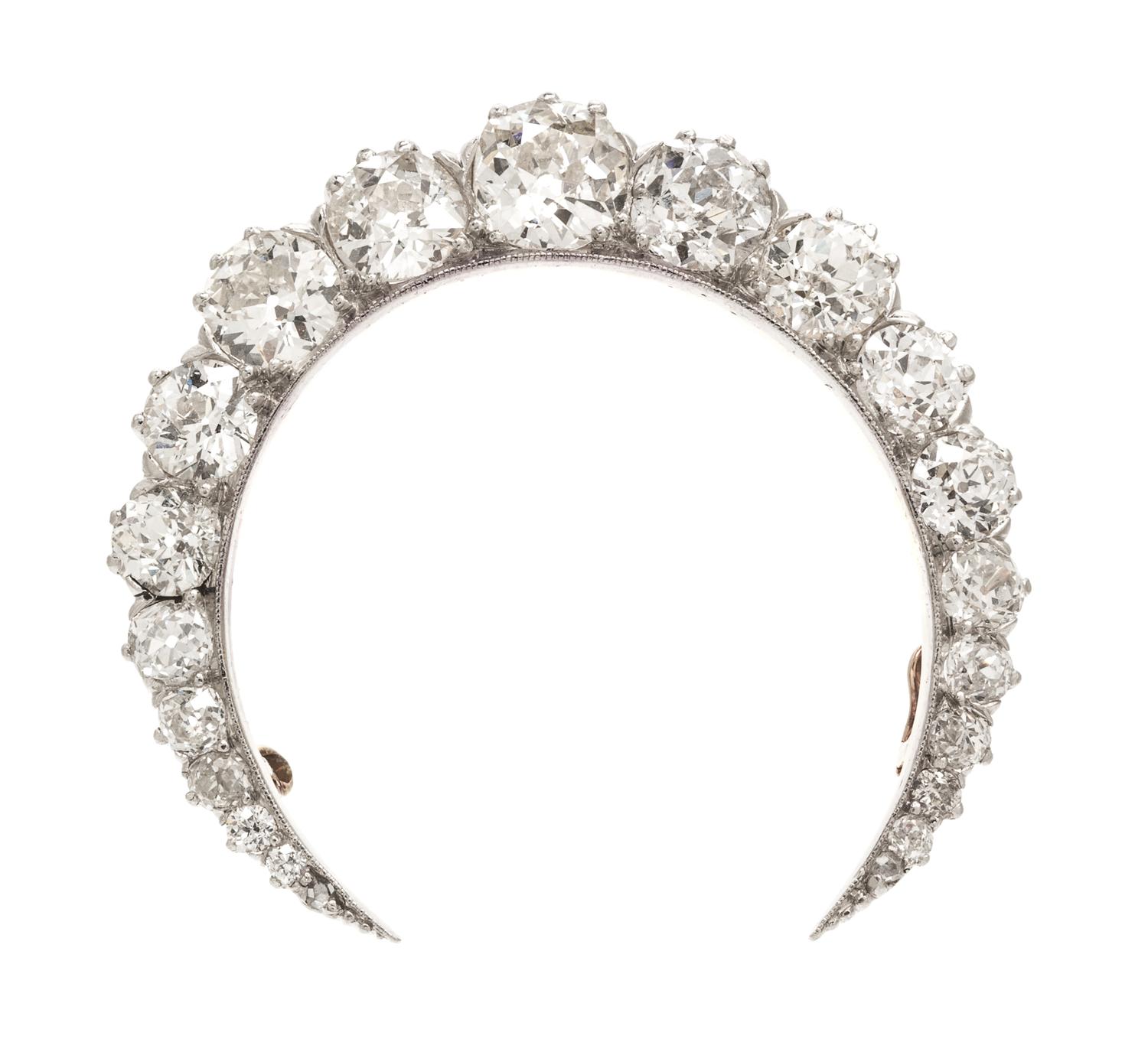 An Edwardian Platinum Topped Gold and Diamond Crescent Brooch, 8.50 dwts.