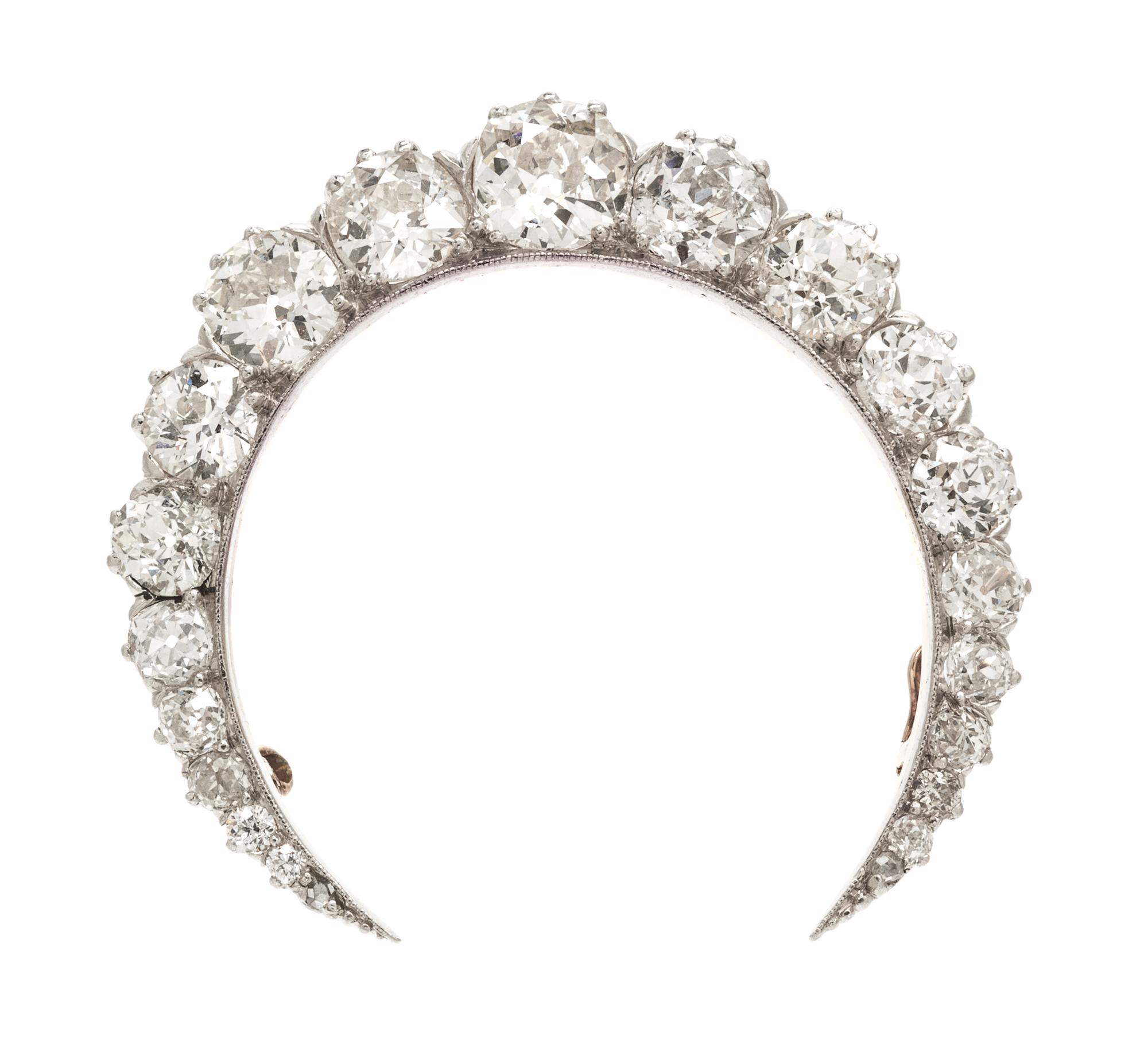 An Edwardian Platinum Topped Gold and Diamond Crescent Brooch, 8.50 dwts.