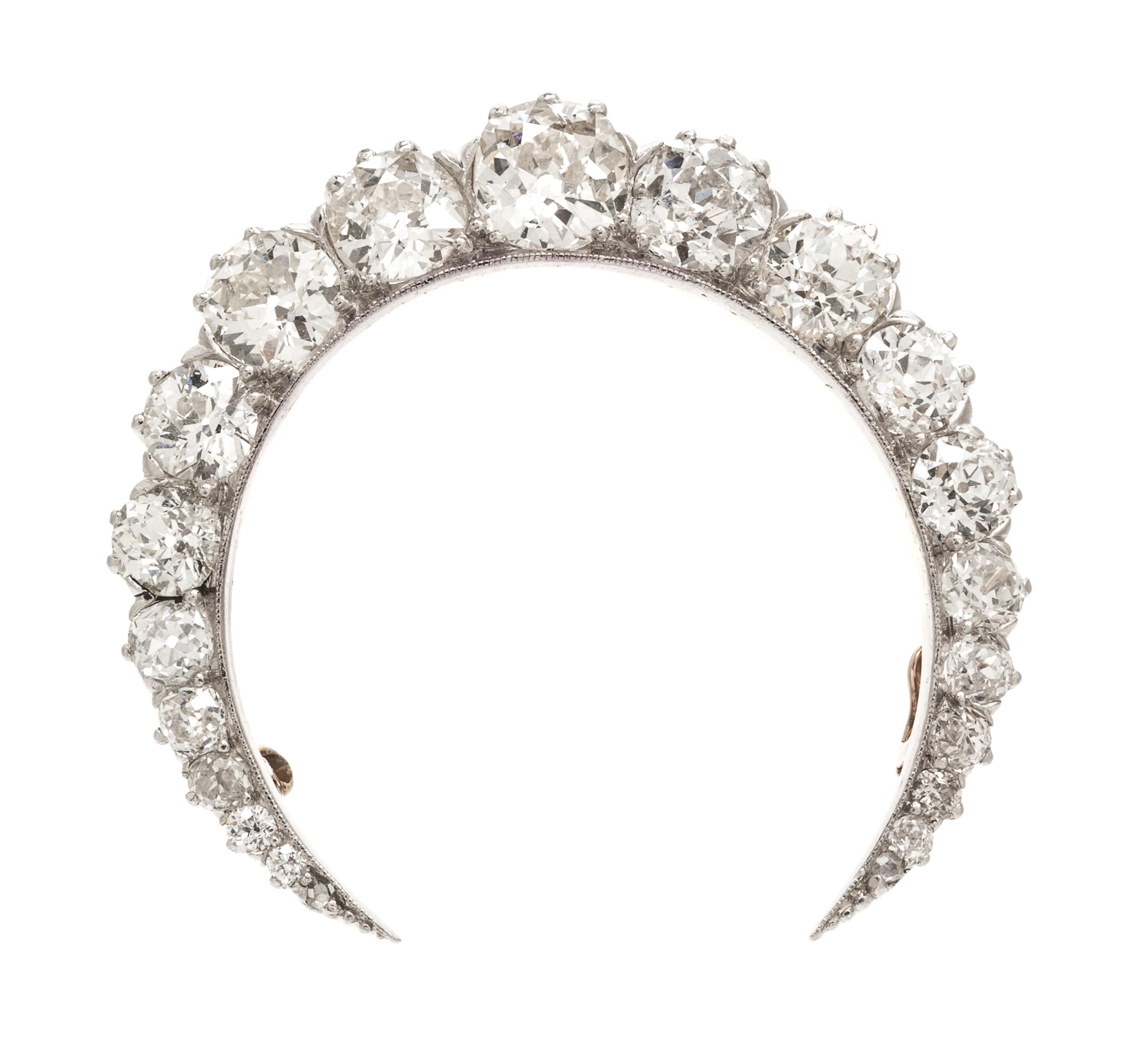 An Edwardian Platinum Topped Gold and Diamond Crescent Brooch, 8.50 dwts.