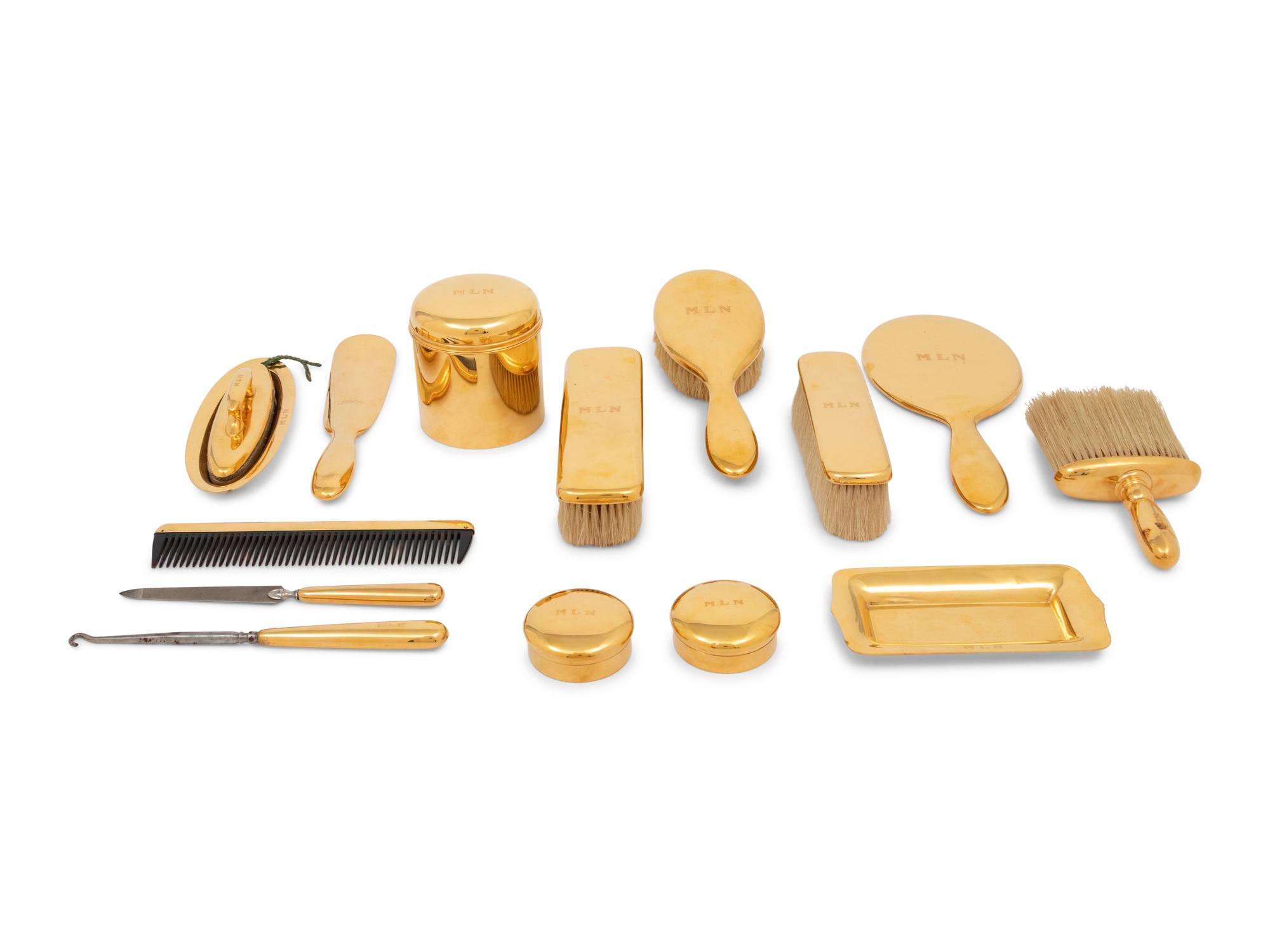 A Tiffany and Co. 18-Karat Yellow-Gold Fourteen-Piece Dresser Set