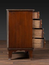 A Federal Inlaid and Figured Mahogany Bow-Front Chest of Drawers