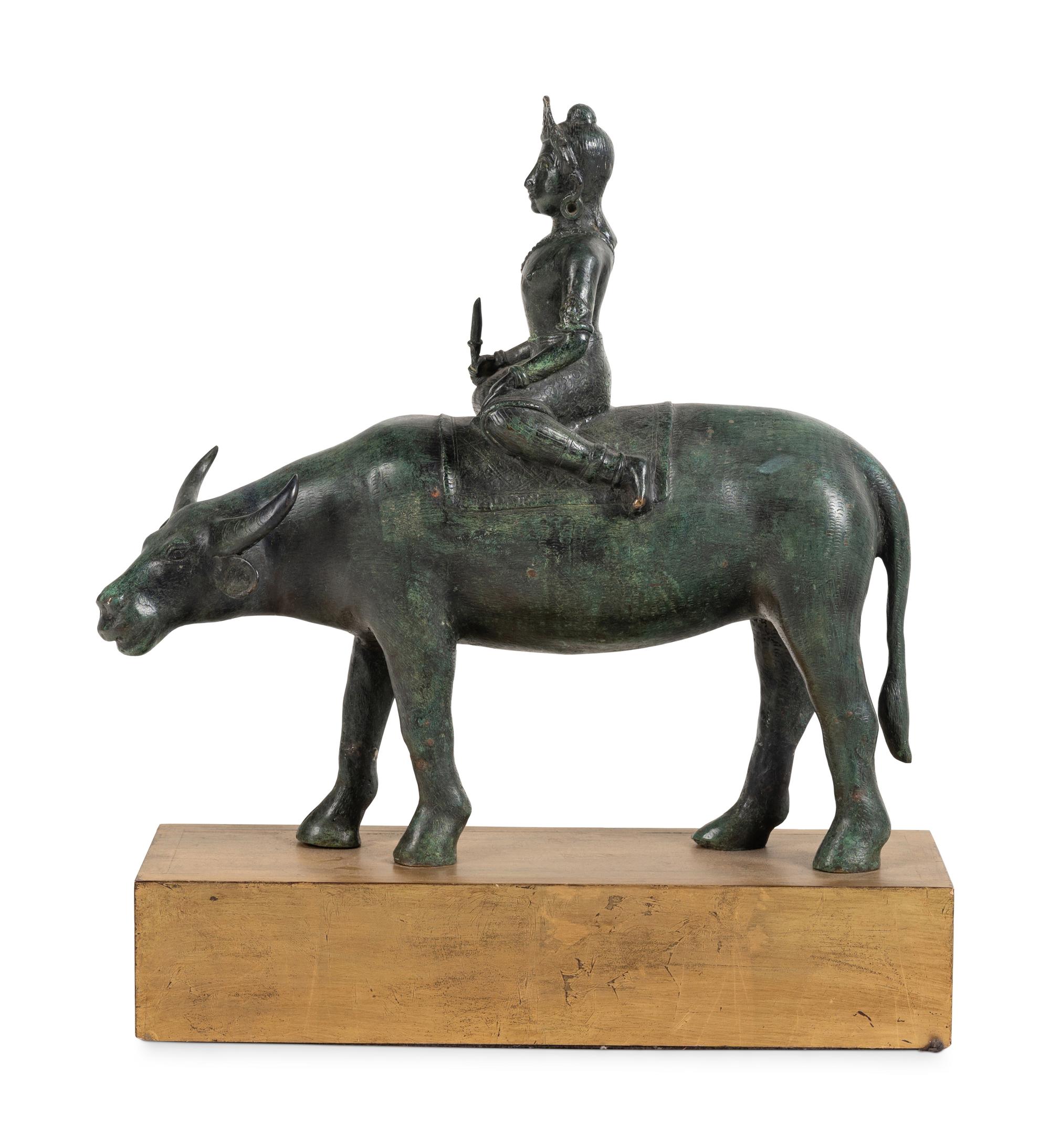 An Indian or Southeast Asian Bronze Model of a Figure on a Water Buffalo