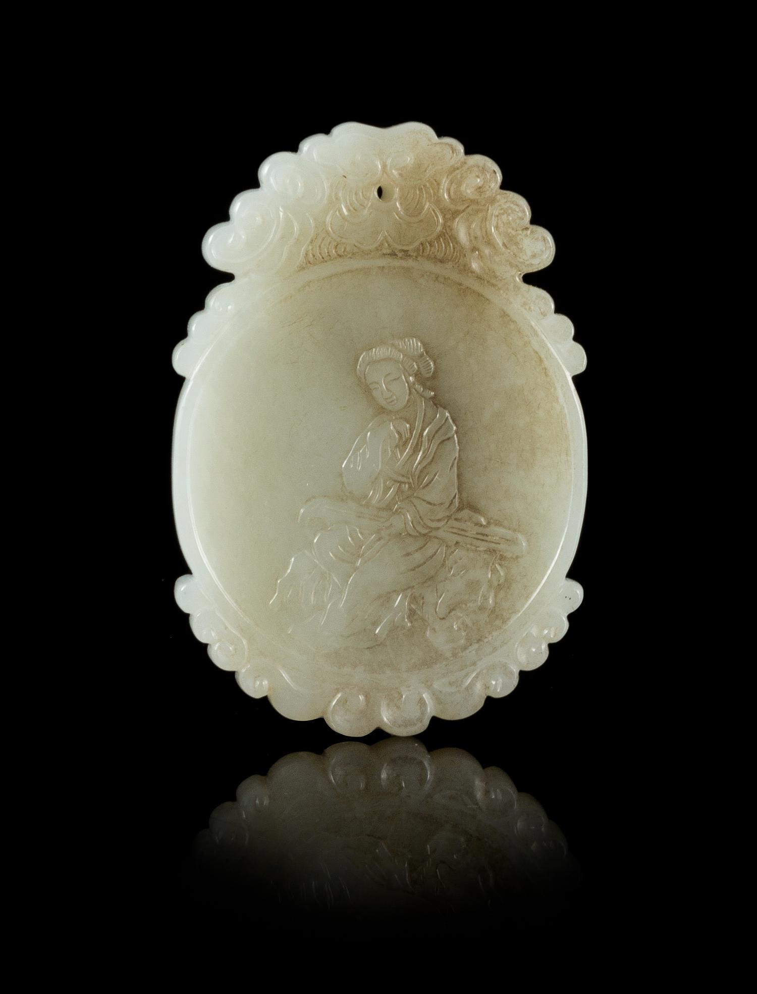 A White Jade Oval Plaque Length 2 1/4 inches.