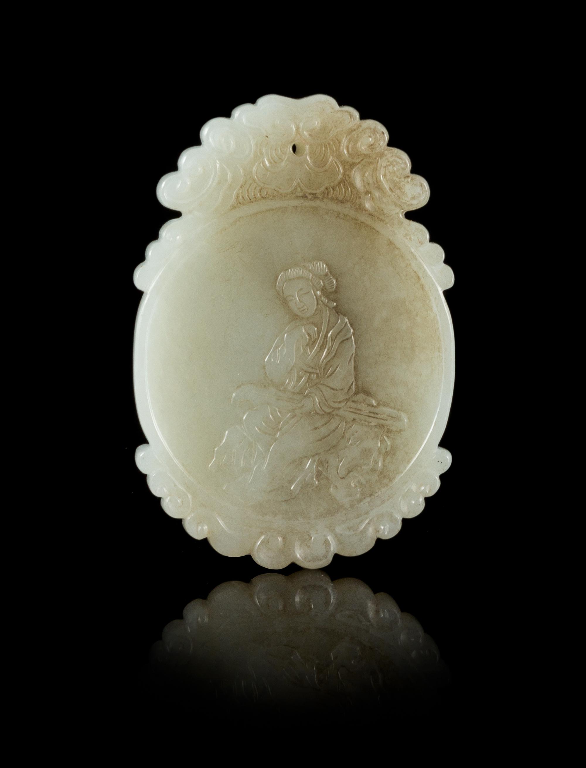 A White Jade Oval Plaque Length 2 1/4 inches.