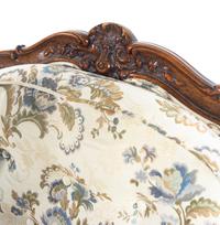 A Louis XV Style Carved Walnut Fauteuil