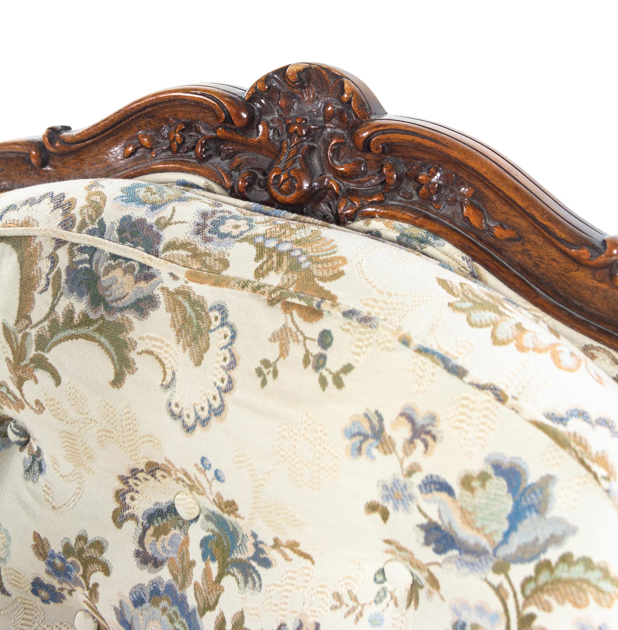 A Louis XV Style Carved Walnut Fauteuil