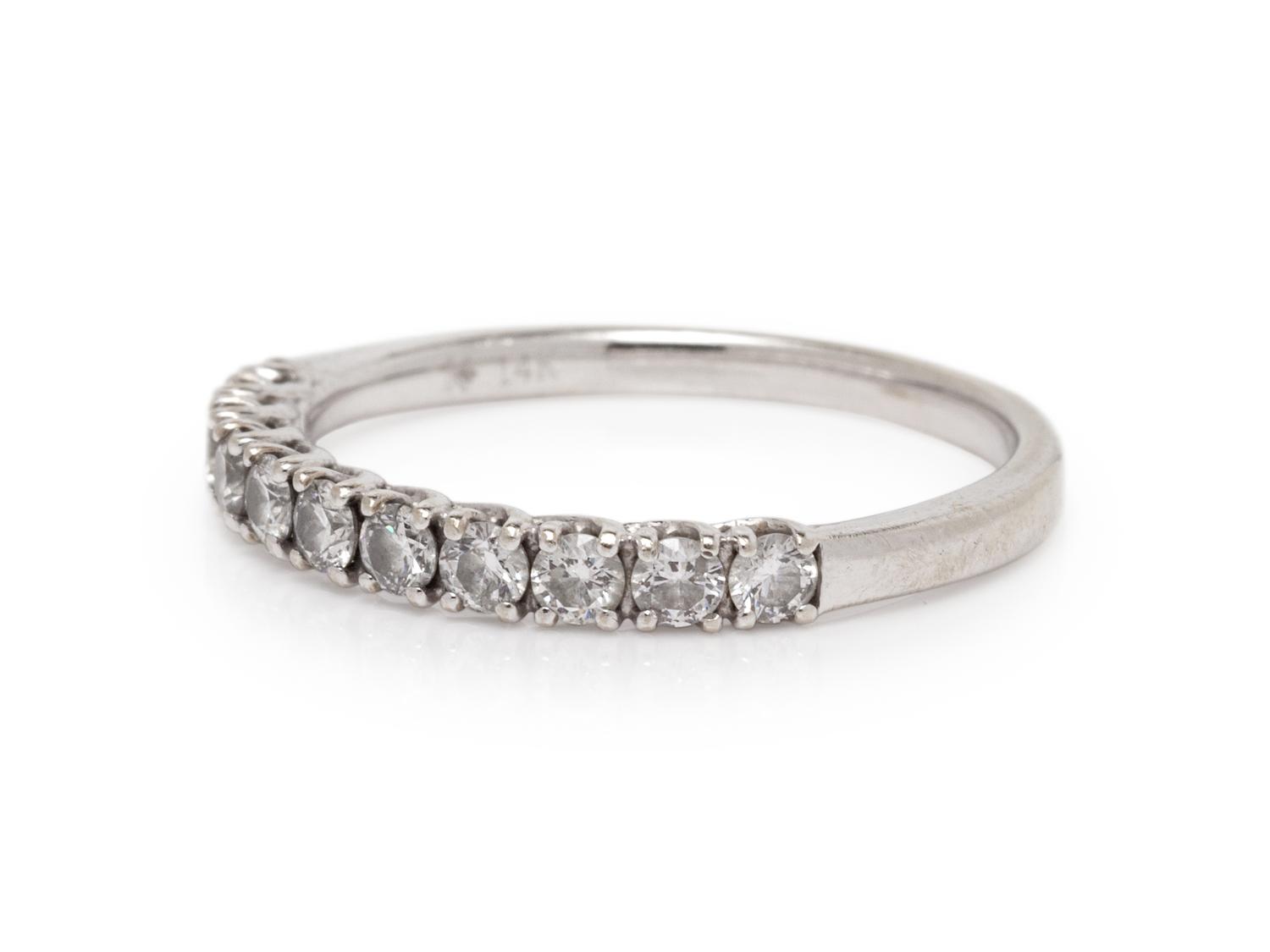 A 14 Karat White Gold and Diamond Ring,