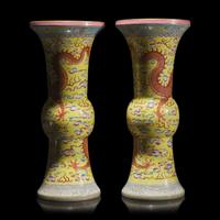 A Pair of Chinese Yellow Ground Finely Decorated Famille Rose 'Dragon' Vases 黃地粉彩雲龍紋花觚一對