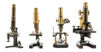 A Group of Four Brass and Black Lacquered Microscopes Height of tallest 11 3/4 inches. — LEITZ, BAUSCH & LOMB AND OTHERS