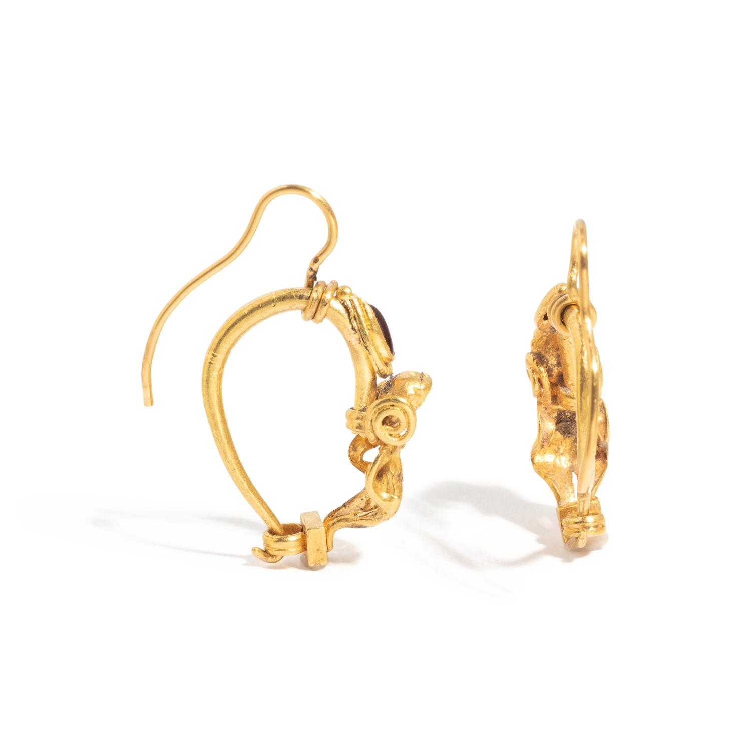 A Pair of Hellenistic Gold and Garnet Earrings with the God Eros