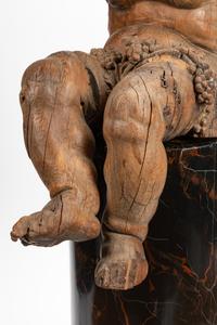 An Italian Carved Wood Figure of Bacchus on a Later Associated Faux Marble Pedestal