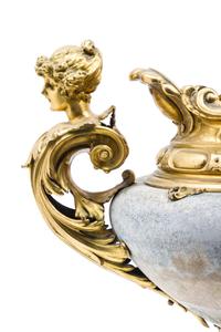 A French Gilt Metal Mounted Ceramic Urn Height 16 1/2 x width over handes 21 inches.