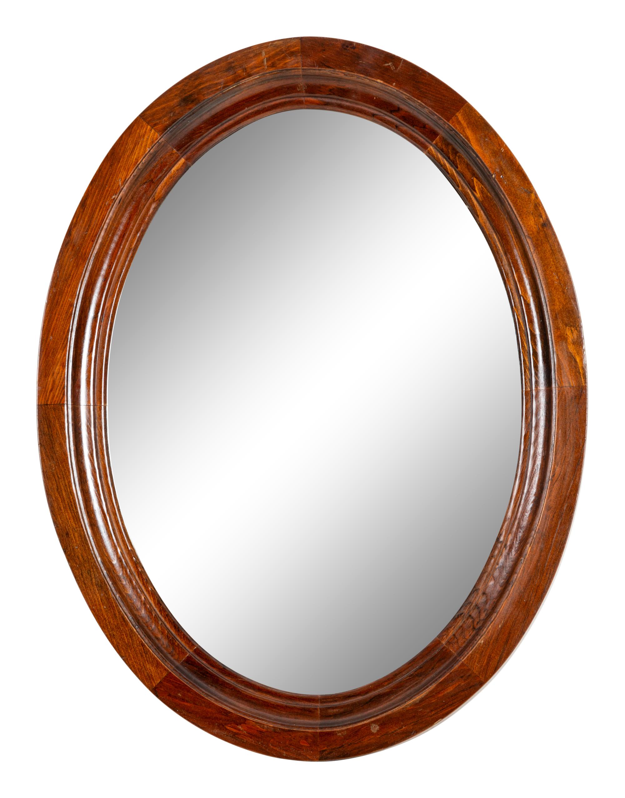 A Pair of Mahogany Oval Mirrors