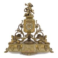 An Aesthetic Movement Gilt Metal Mantel Clock Height 16 inches. — LATE 19TH CENTURY