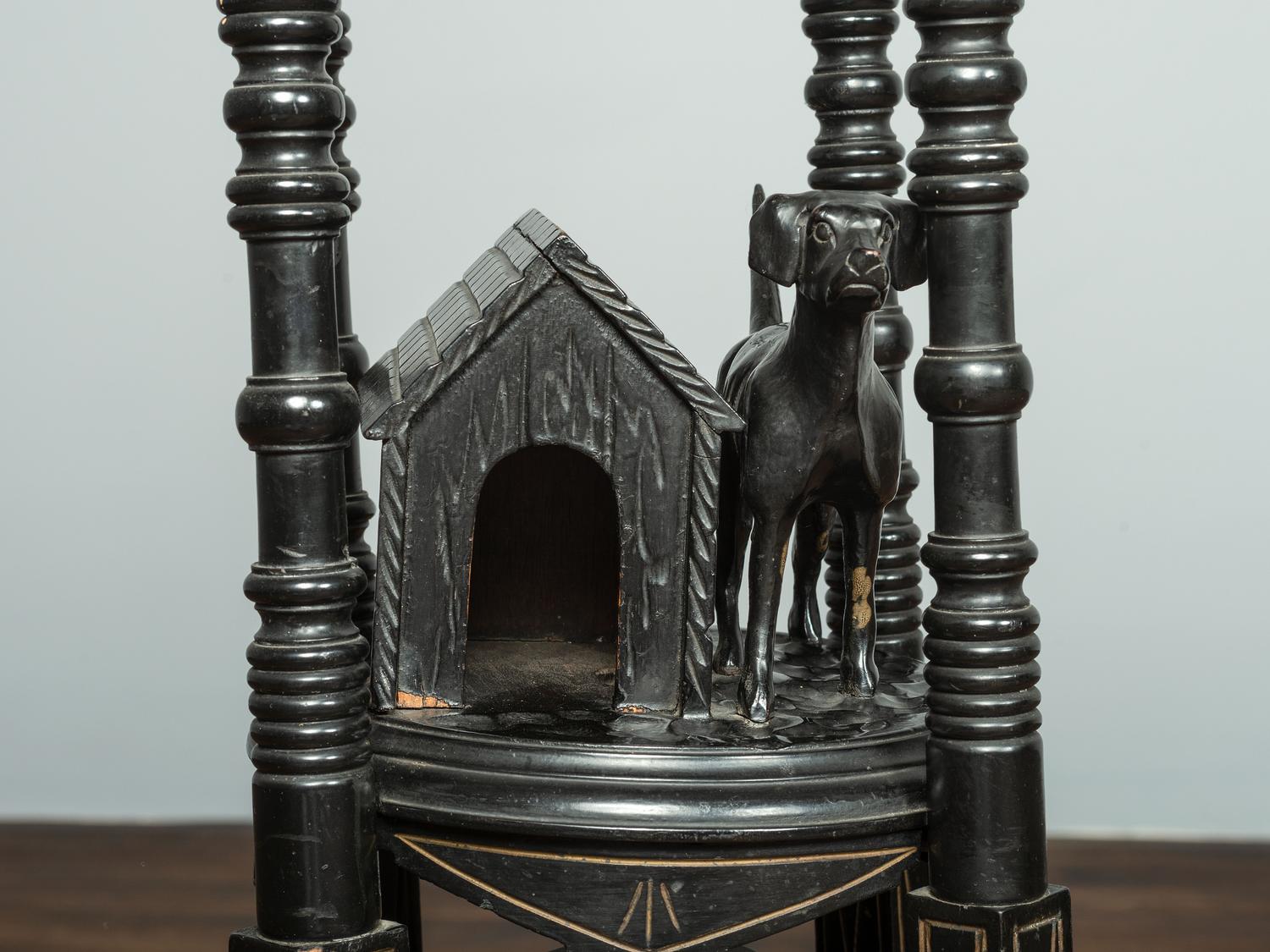 A Victorian Marble-Top Carved and Ebonized Parlor Table with Dog