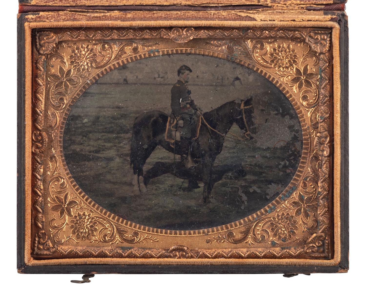 [CIVIL WAR]. Quarter plate hand-tinted tintype of a Union cavalry officer on horseback.