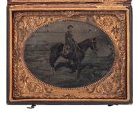 [CIVIL WAR]. Quarter plate hand-tinted tintype of a Union cavalry officer on horseback.