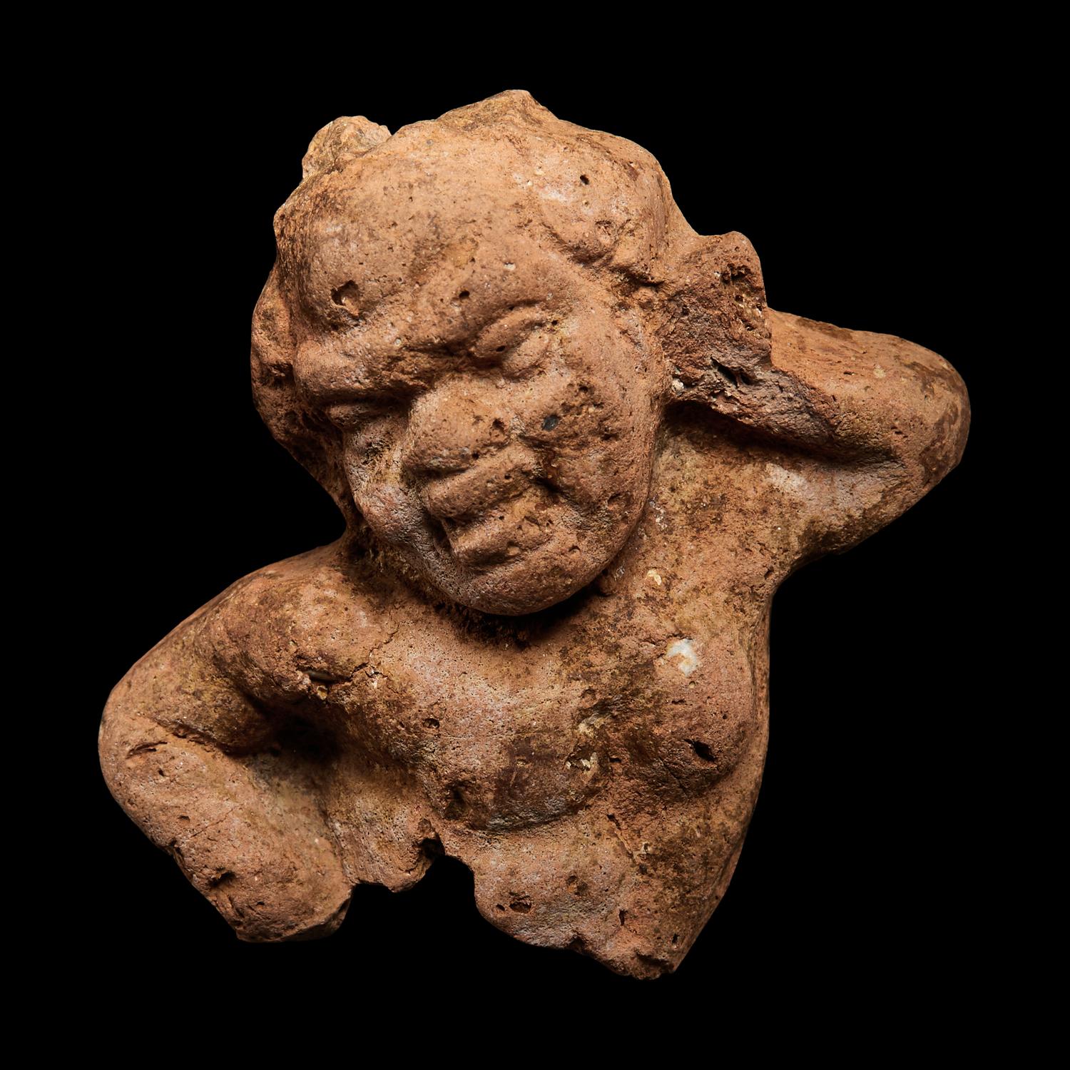 A Nubian Terracotta Head and Reclining Figure