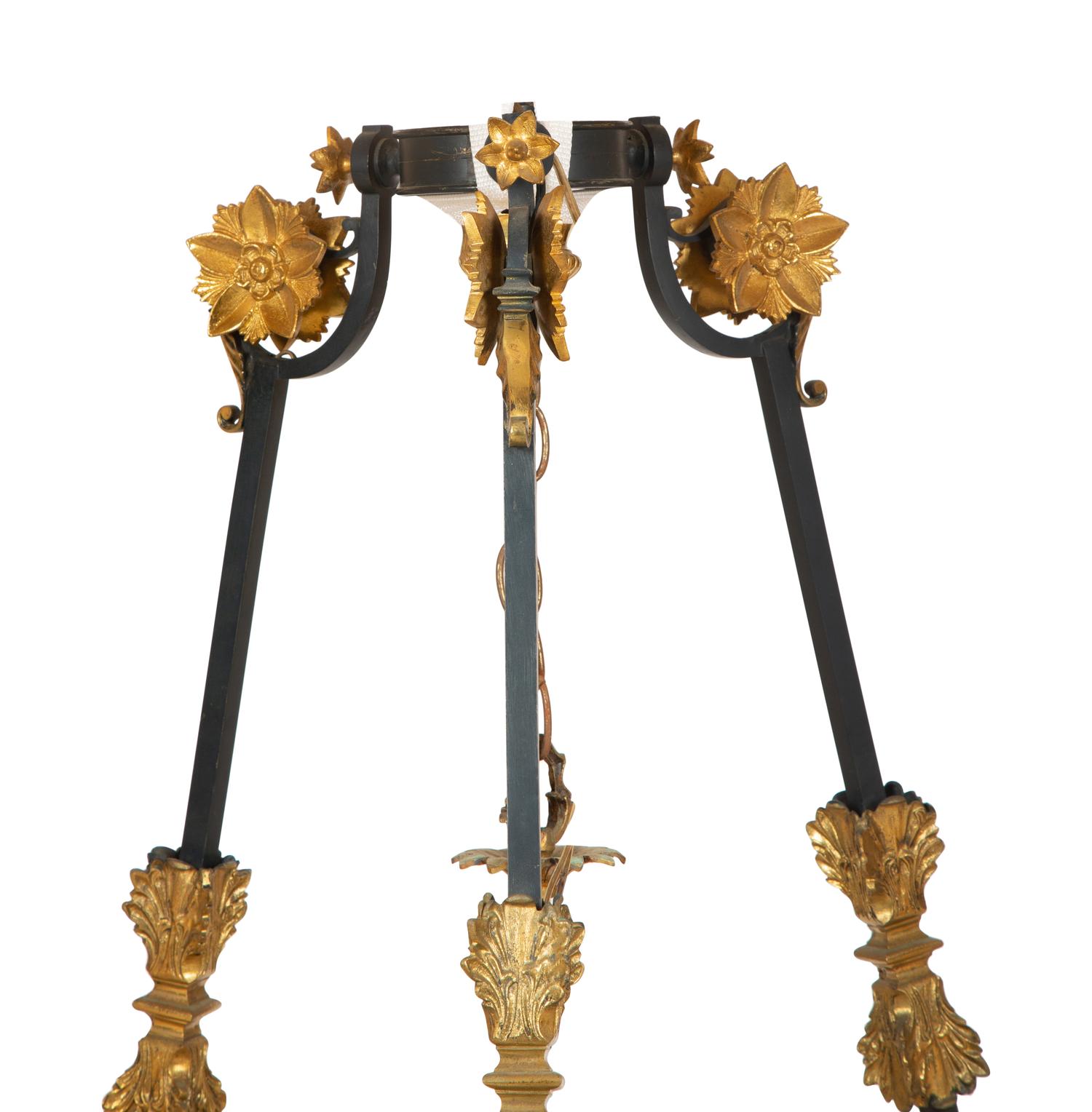 A French Empire Style Ebonized and Gilt Metal Fourteen-Light Chandelier