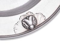 A Set of Twelve Georg Jensen Silver Bread Plates
