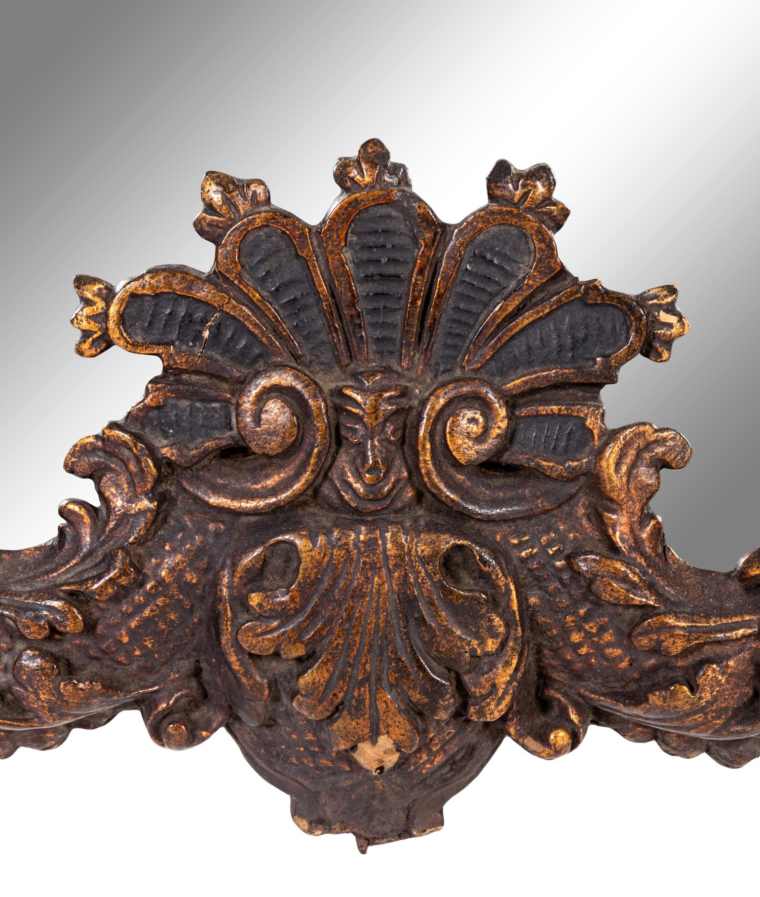 An Italian Baroque Style Giltwood Mirror