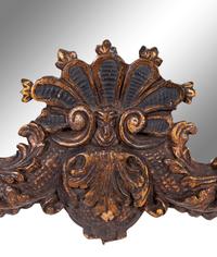 An Italian Baroque Style Giltwood Mirror