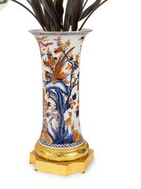 A Pair of Gilt Bronze Mounted Imari Palette Porcelain Vases with Biscuit Porcelain Tulip Arrangements