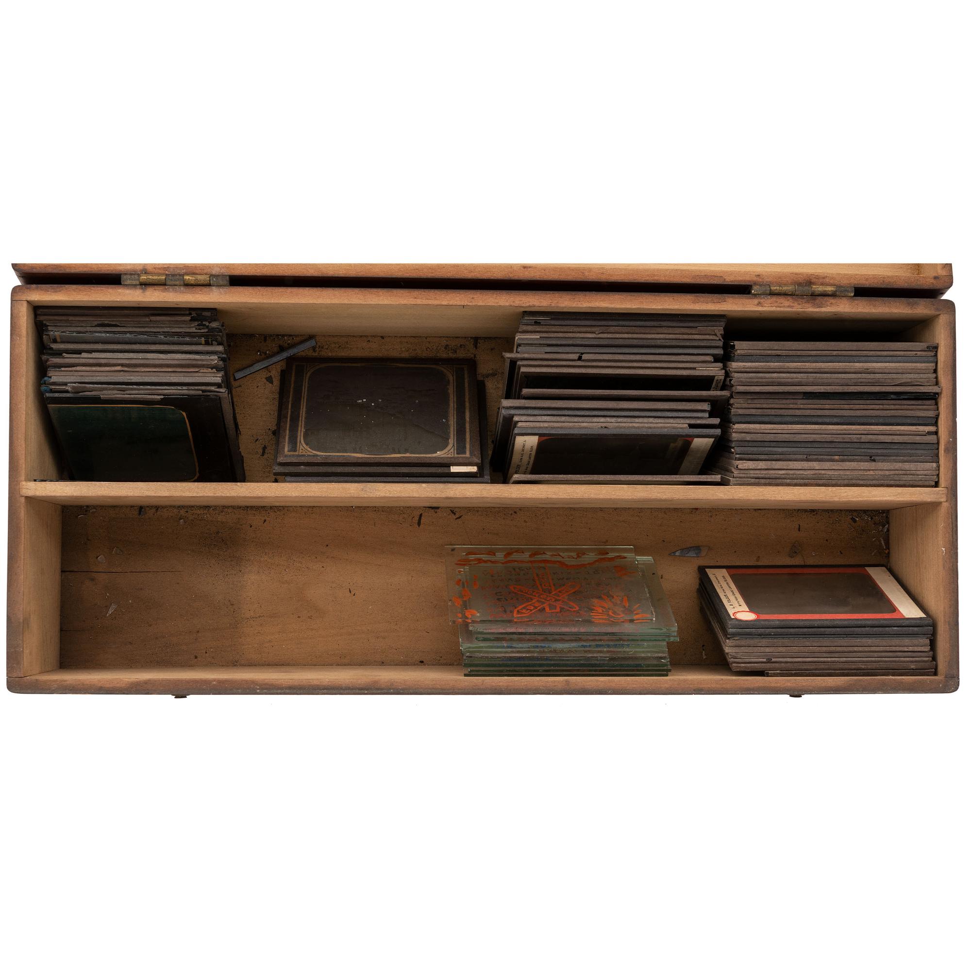 [EARLY PHOTOGRAPHY]. A group of magic lantern travel views in early wooden box, comprising: