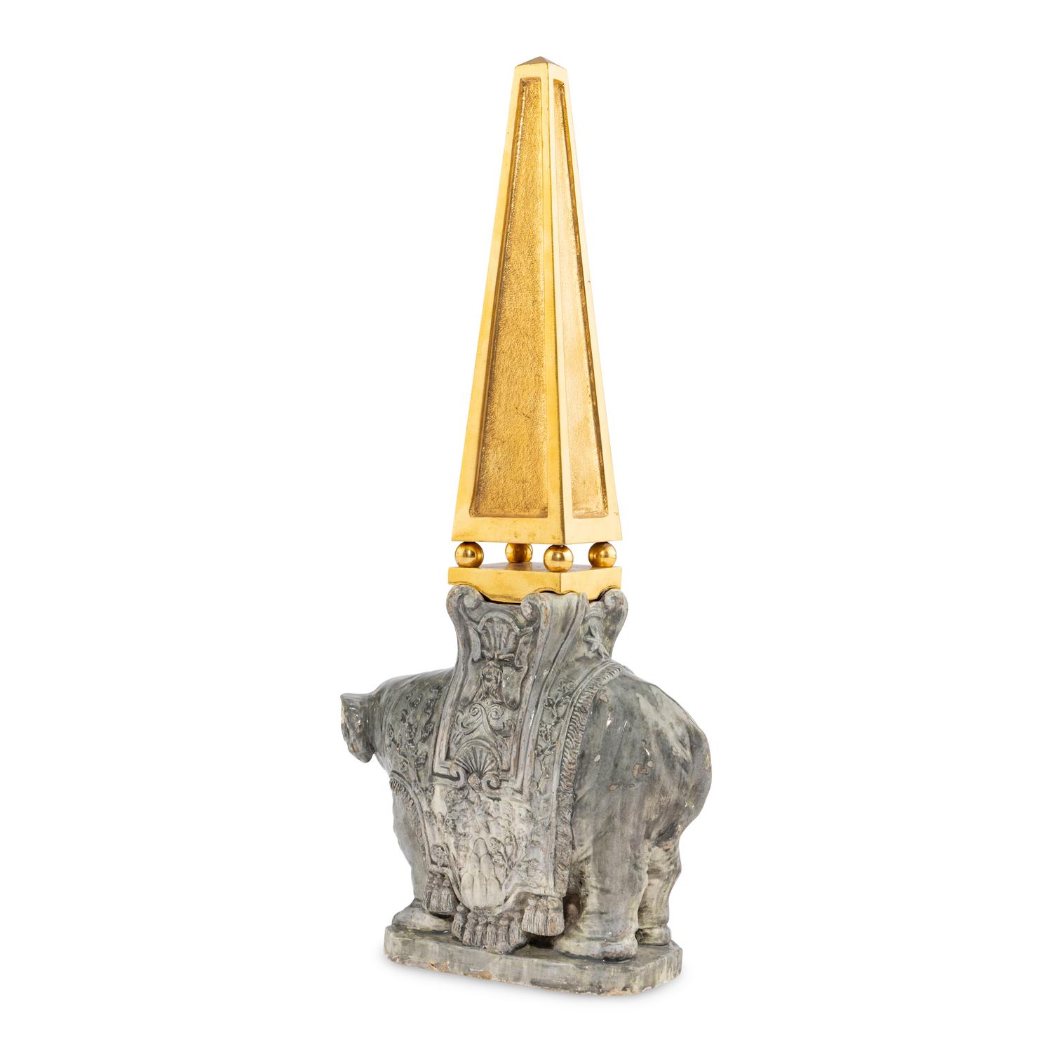 A Continental Gilt Bronze and Glazed Earthenware Elephant Obelisk